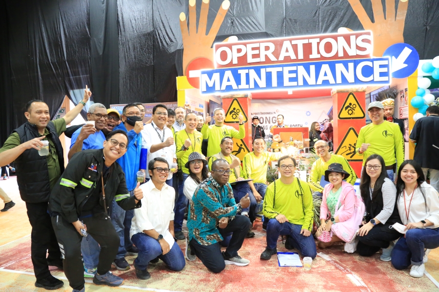 Judges took pictures in front of Operation Maintenance's booth