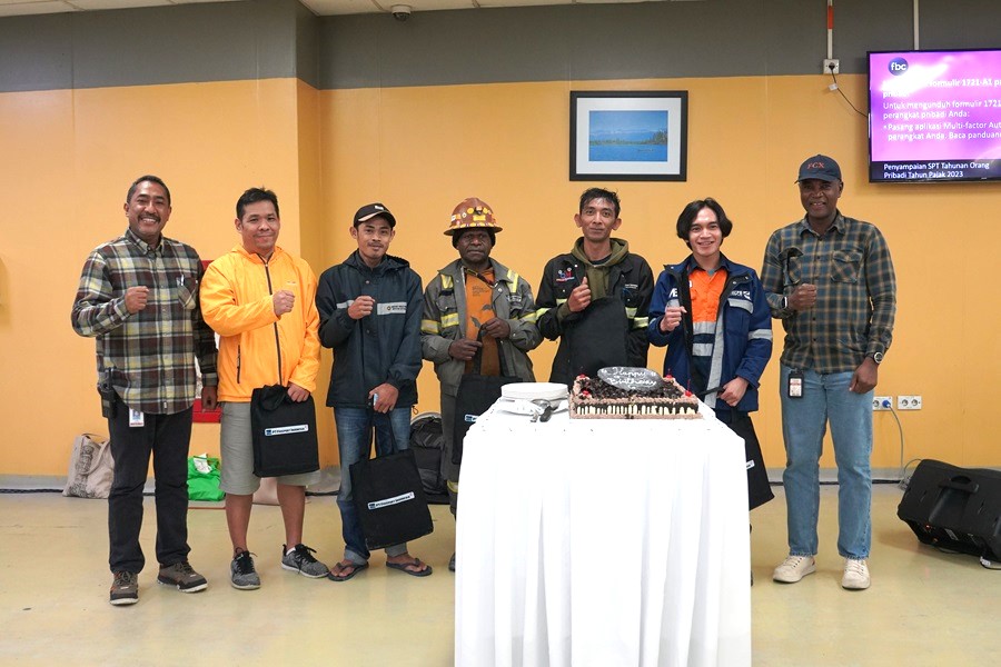 George Banini and Carl Tauran handed over a birthday present to birthday employees