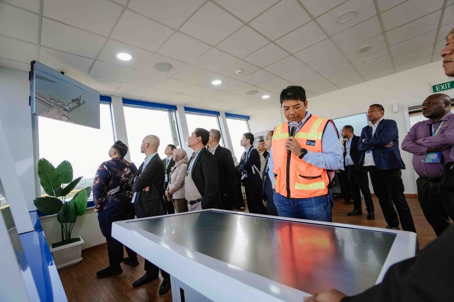 Karel Pramono briefs the delegates during a field inspection